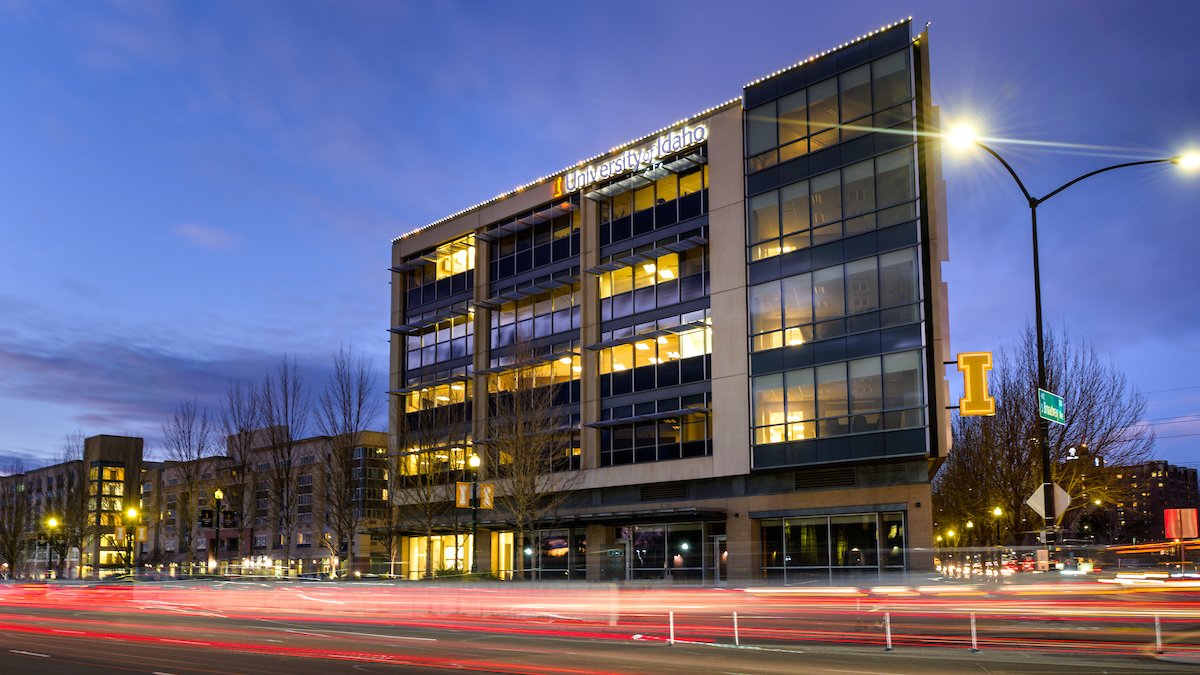 The Urban Design Center building at dusk with the University of Idaho logo on the side.