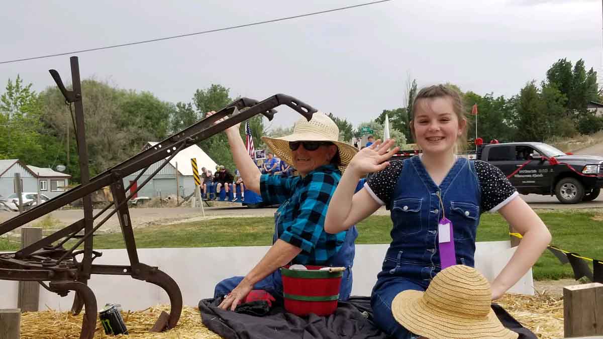 Parma employee and granddaughter dressed as farmers for the Old Fort Boise Days parade