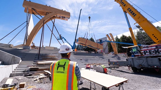 Architects oversee the initial framing of the ICCU Arena.