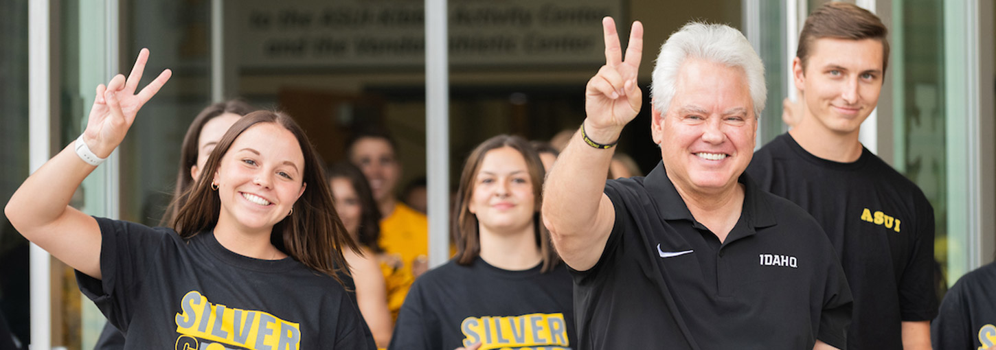 President Green walking around campus with students