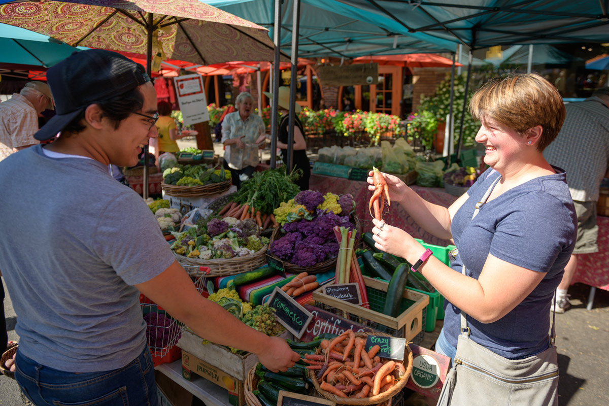 A vendor sells vegetables at the Farmers' Market in downtown Moscow.