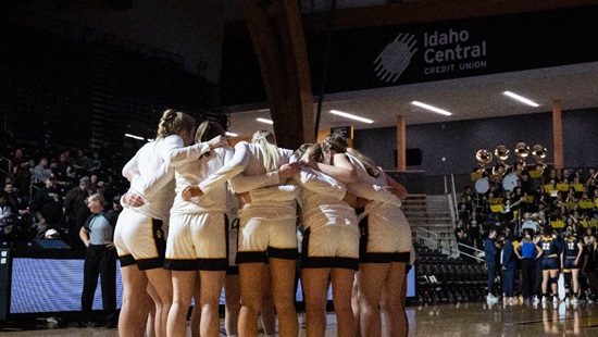 The U of I women's basketball team huddle together during a home game in the ICCU arena. 
