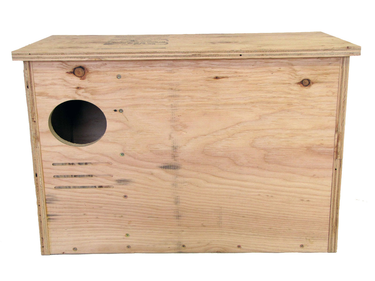 Wooden box with hole in upper left corner