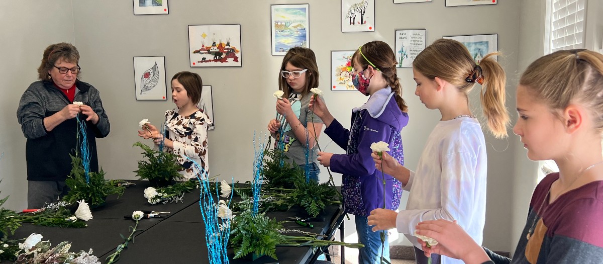 4-H youth taking a floral arranging class