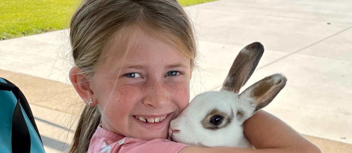 4-H youth and her show rabbit