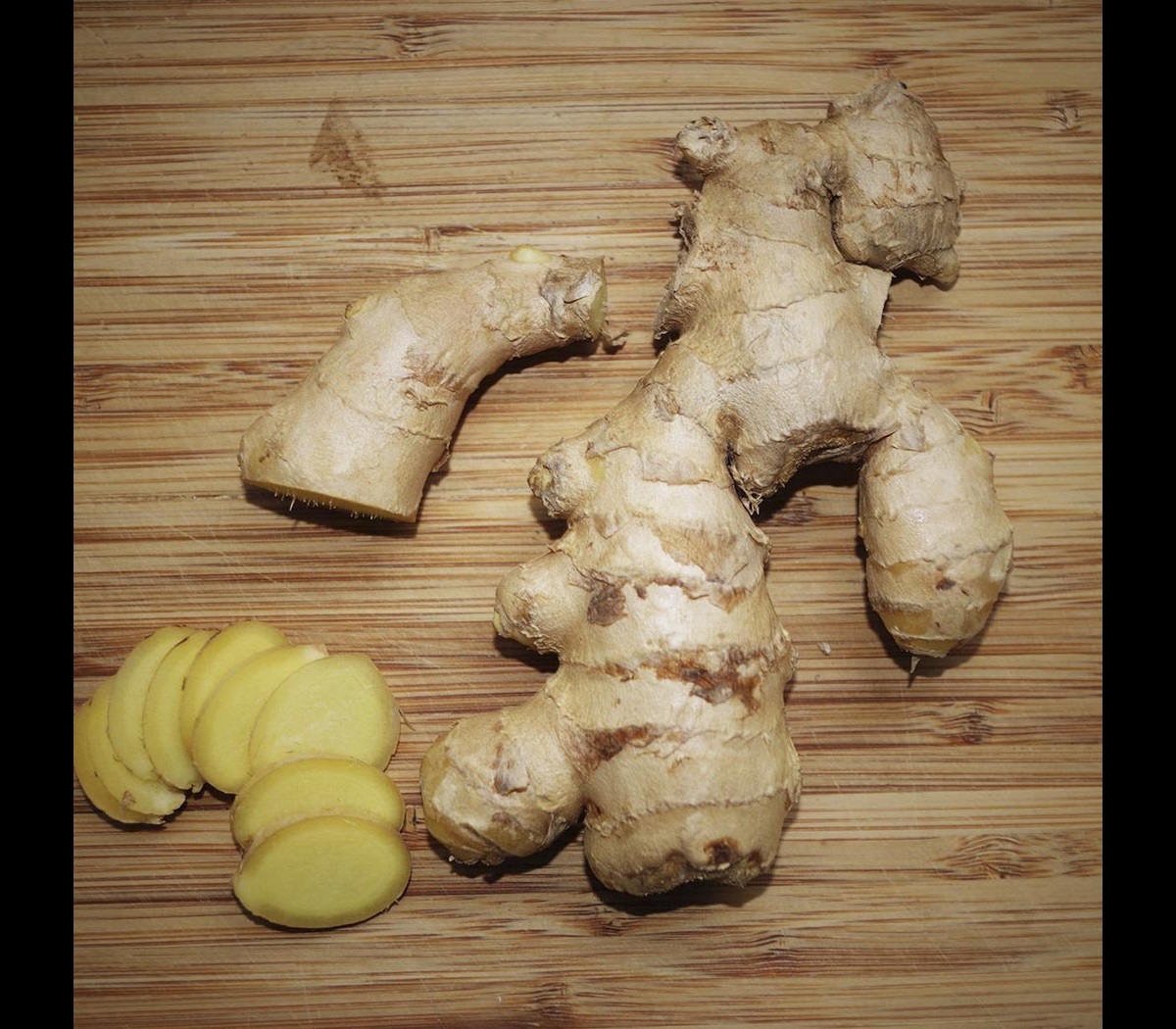 Ginger root, some sliced