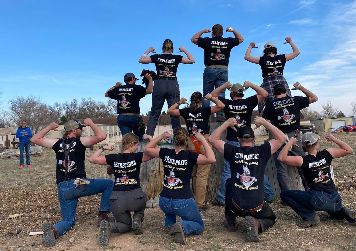 Loggers showing backs of their shirts