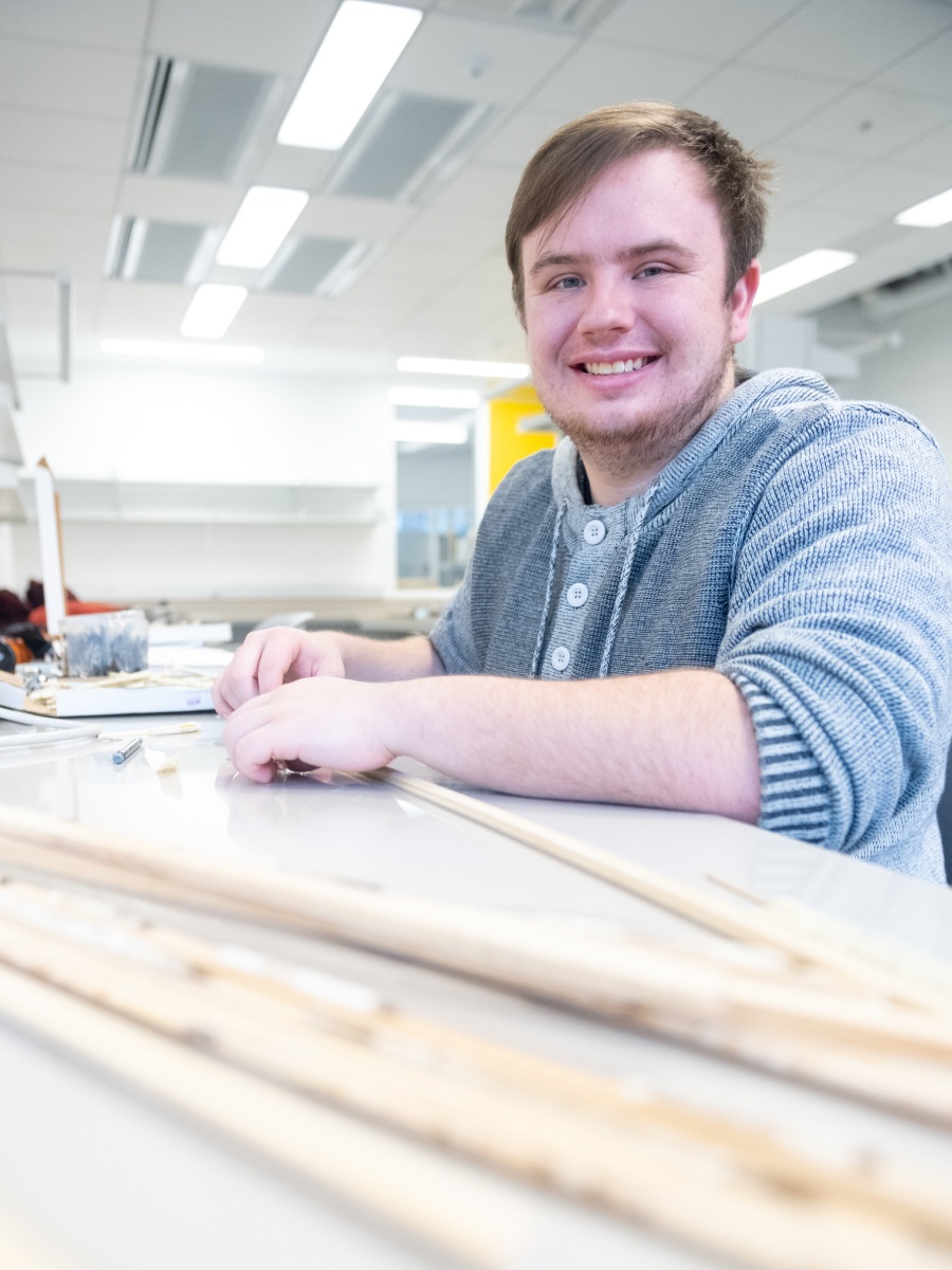 Jonathan Asker glues together tree cores.