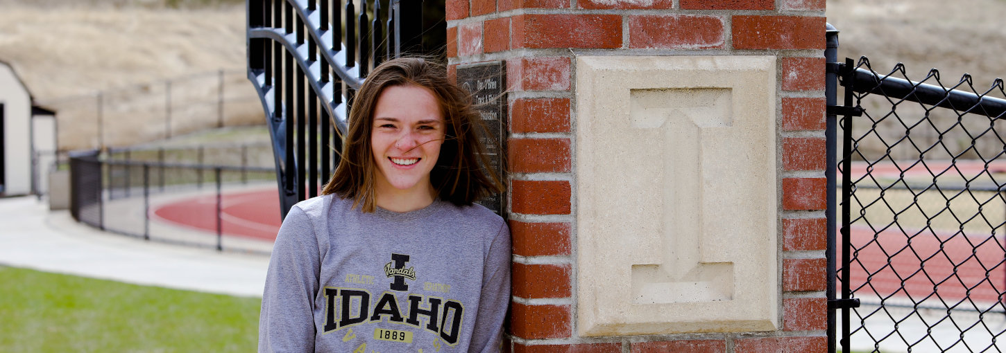 Bec Kirkland standing in front of U of I track.