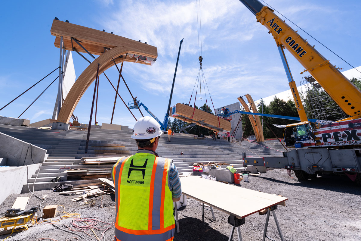 A worker looks on as the support beam for the ICCU Arena is installed.