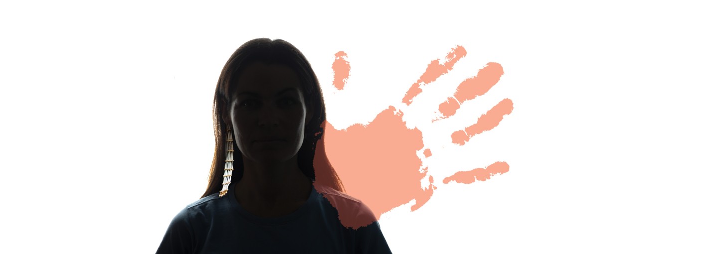 A faceless woman with an Indigenous earring and a red handprint.