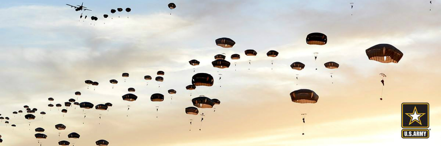 Paratroopers exit a C-130 aircraft.