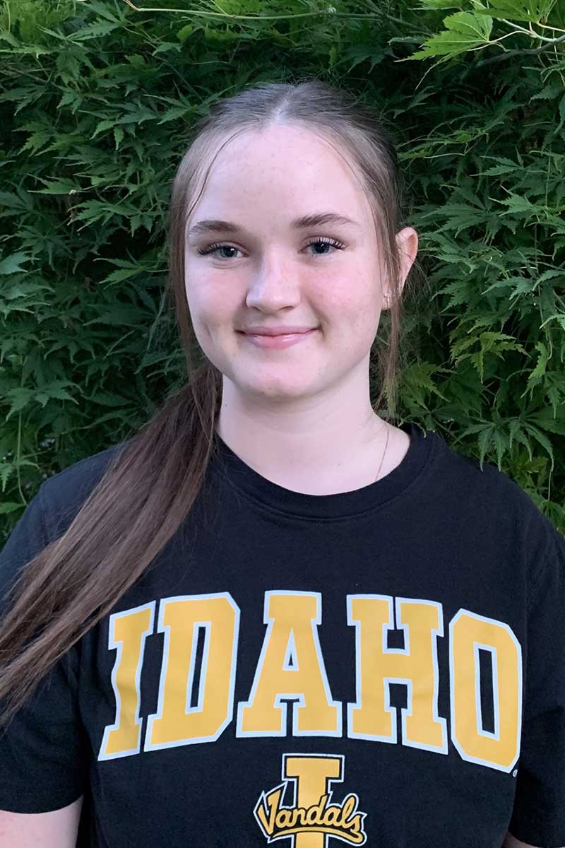 Freshman Emily Cilley smiling at the camera wearing a University of Idaho t-shirt.