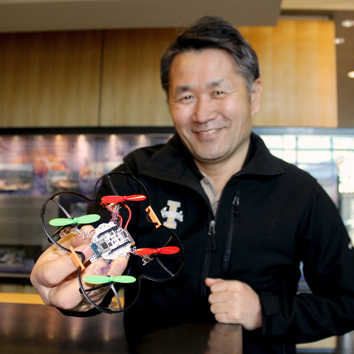 Jay Ryu holds a drone