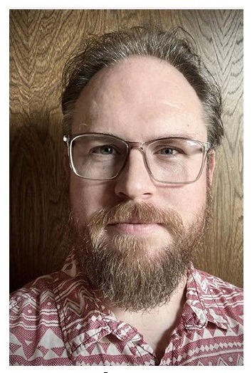 Headshot of Reggie Mace.