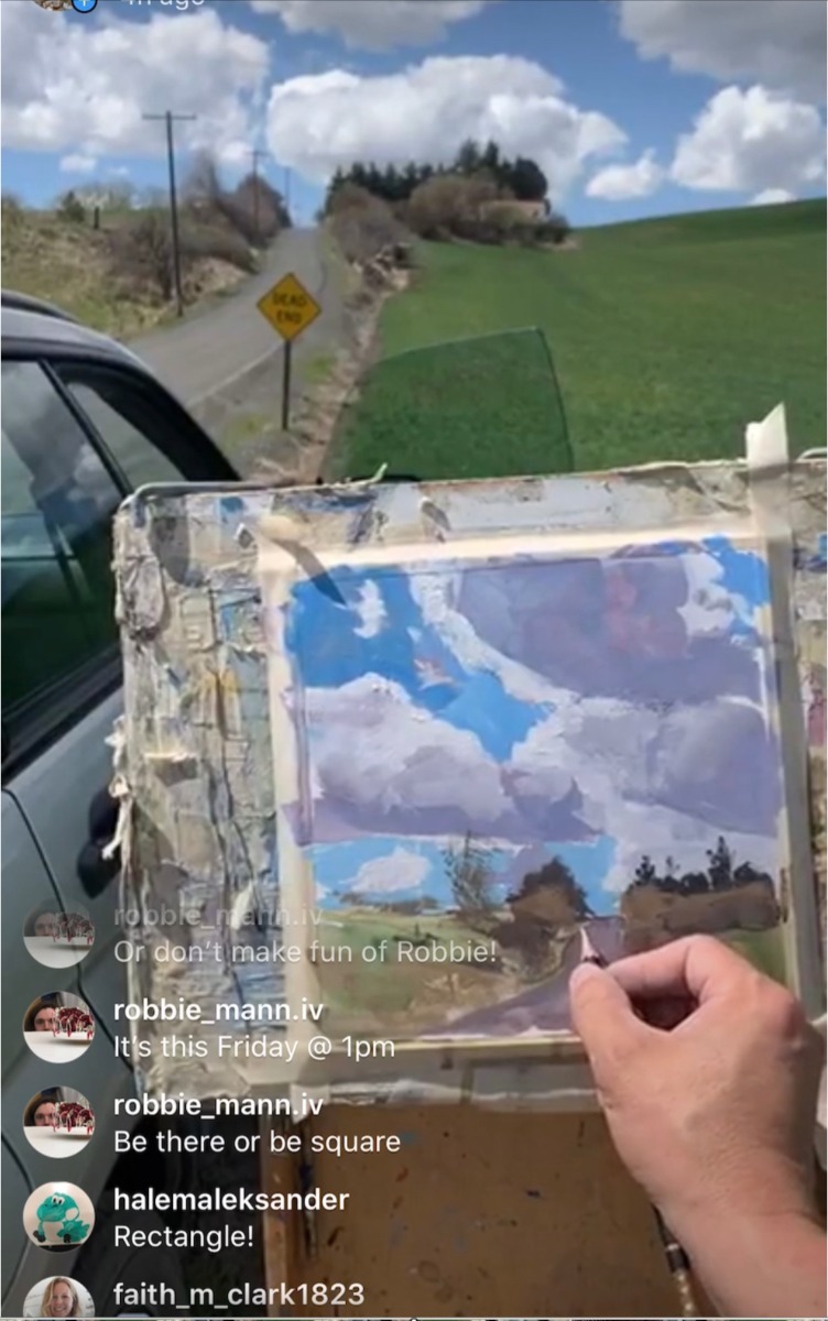 Aaron Johnson paints a scene. Instagram comments from students are visible as he works.