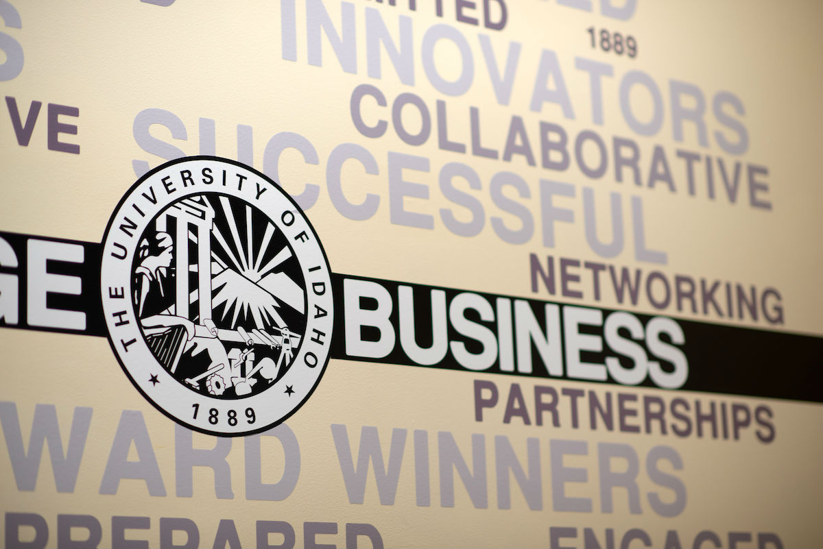 A section of a wall mural with the U of I logo and words including "collaborative," "successful," "networking" and "partnerships."