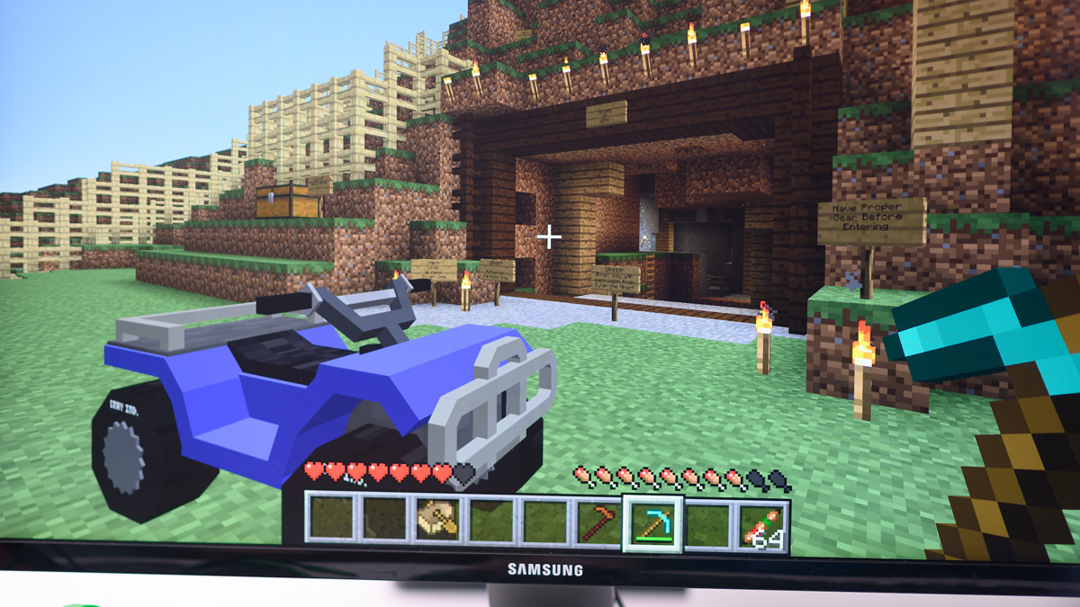 A screenshot of Minecraft with an all-terrain vehicle in game.