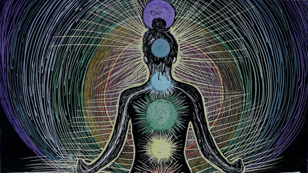 A watercolor print depicting a woman in lotus position facing away, with colored circles along her spine.