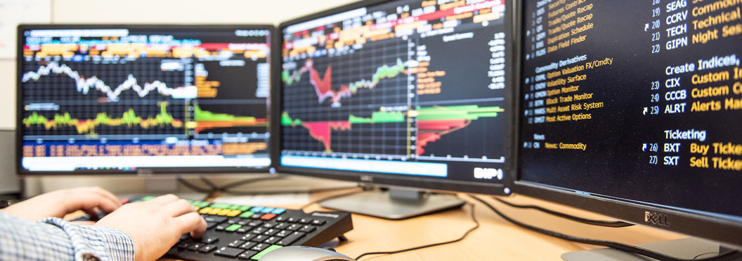 Commodity markets are show on a set of three computer monitors