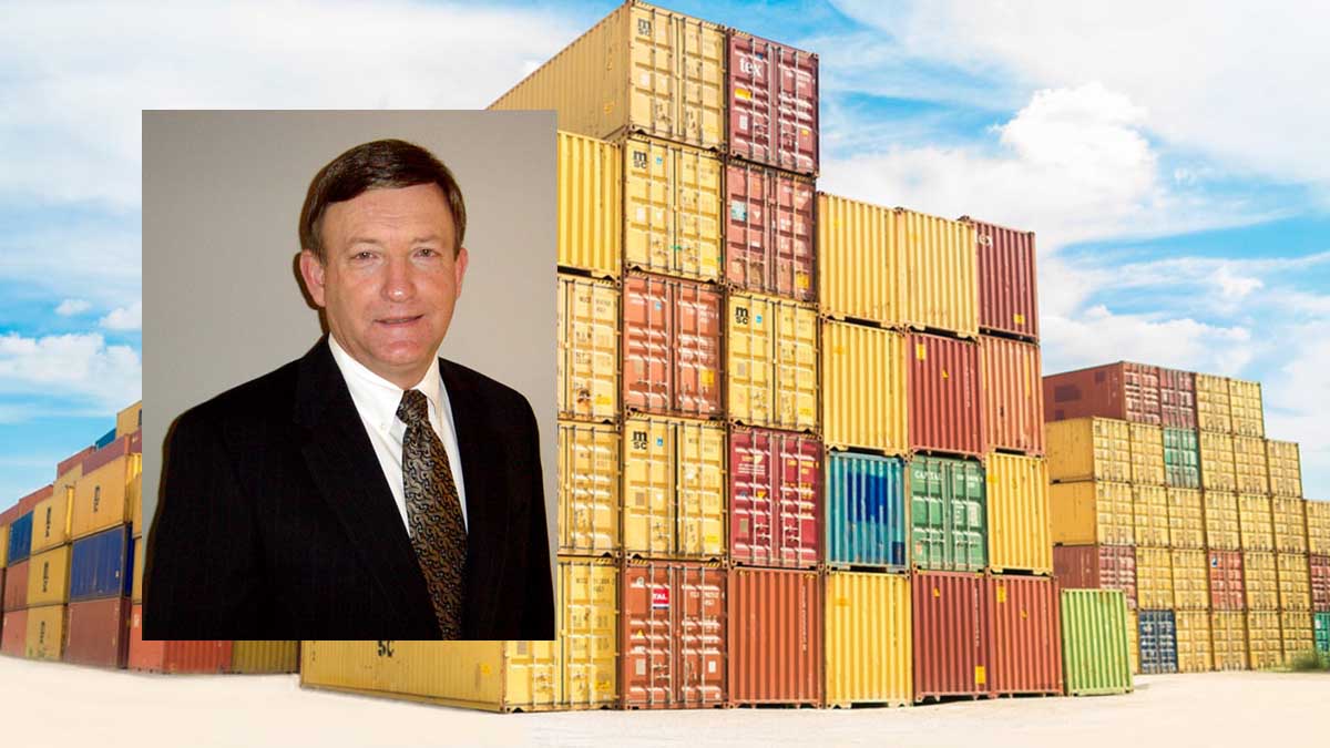 Man in front of containers