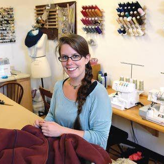Sara Hall in her clothing alterations business Altered Ego.
