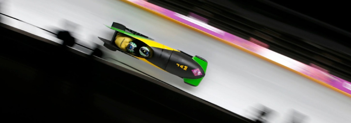 The Jamaican Bobsled team prepares to start their run. 