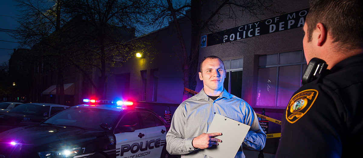 Student interviewing police officer