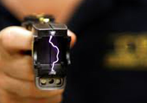 police officer holding a taser