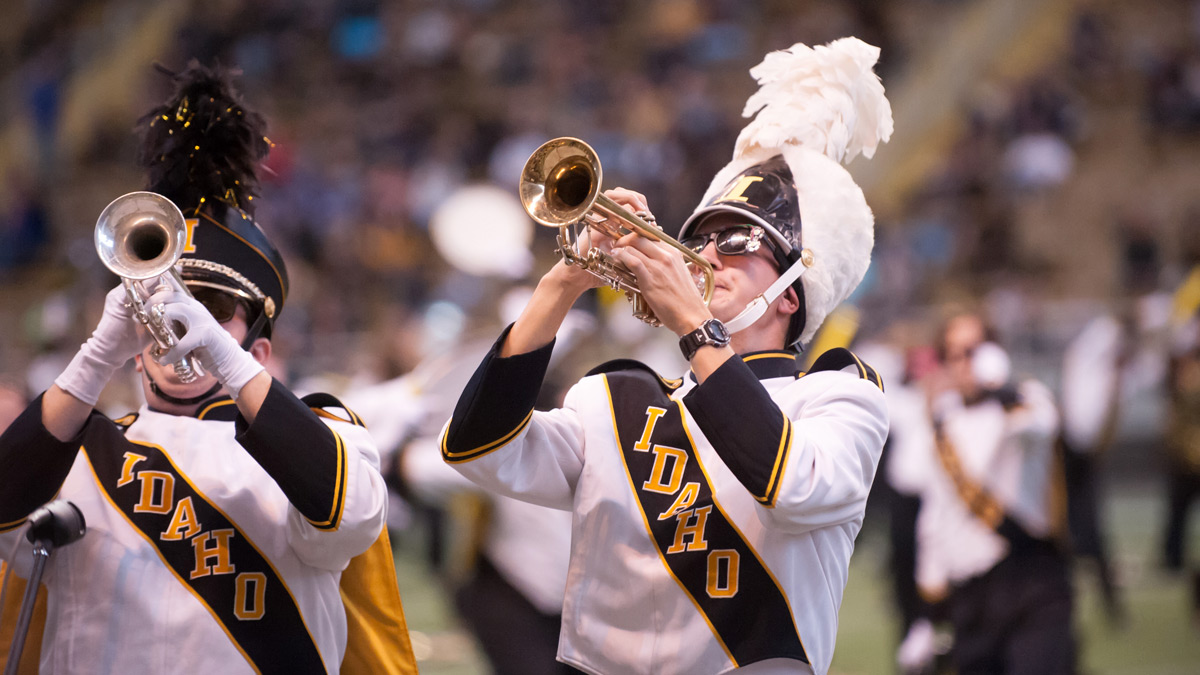 The Vandal Marching Band plays on the field of the Kibbie Dome.