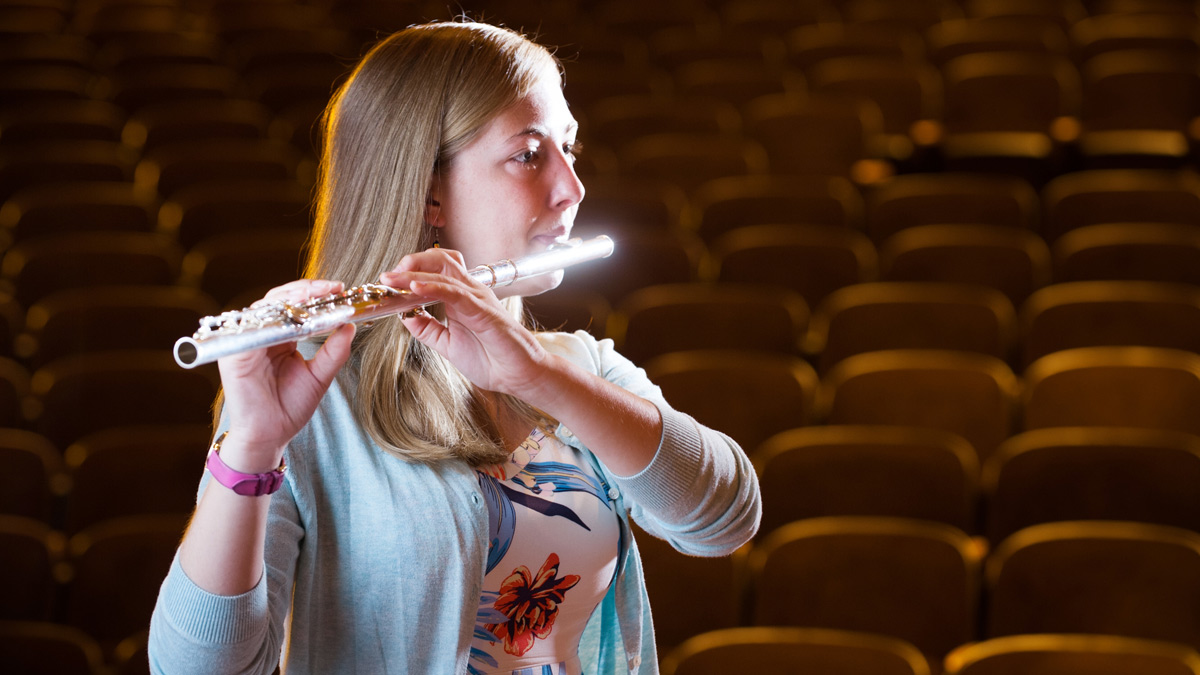 Cheyenne Kilian plays her flute during a performance in the in Haddock Auditorium.