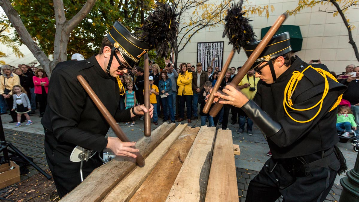 Two members of the Vandal Marching Band play the txalaparta outside of the VandalStore.