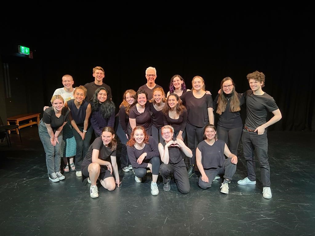 Group of actors on stage.