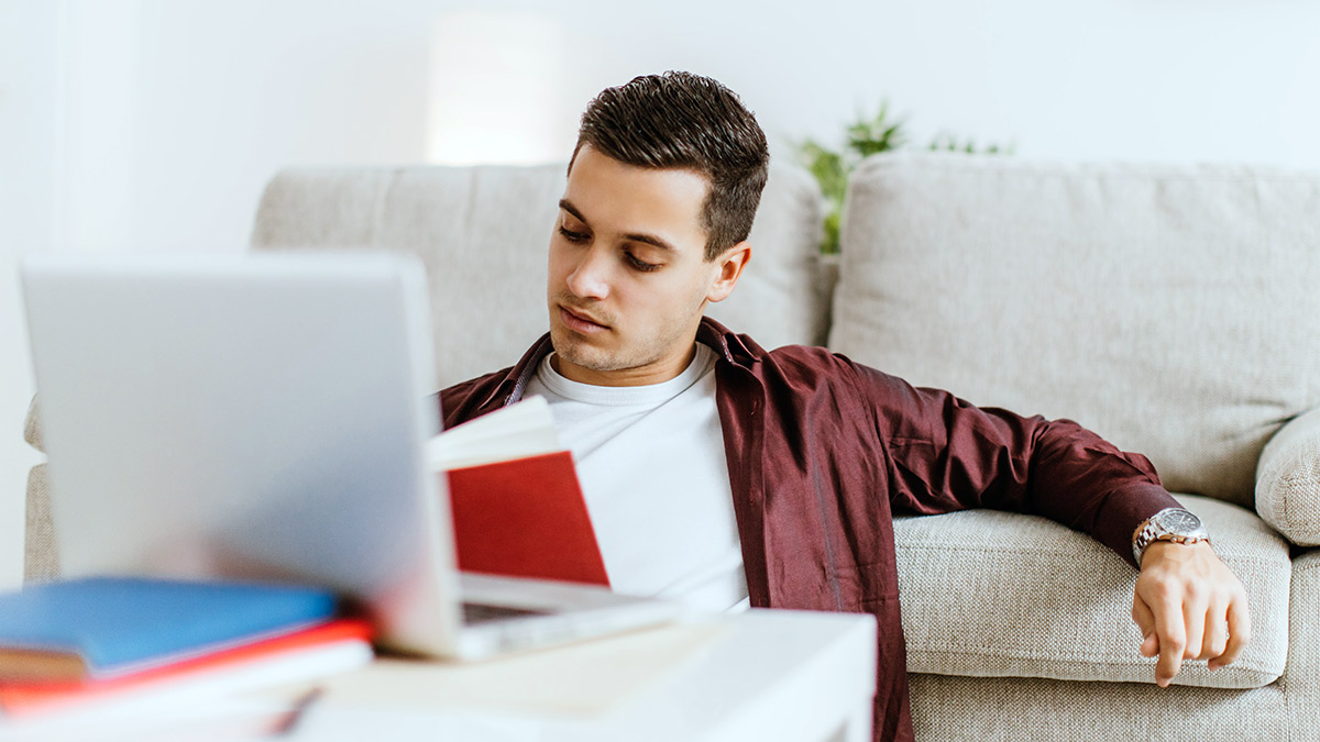 Man studying at home.
