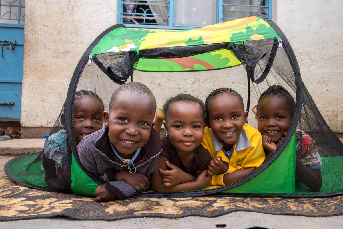 African children safe in their bed net buddy, a mosquito safe bed tent