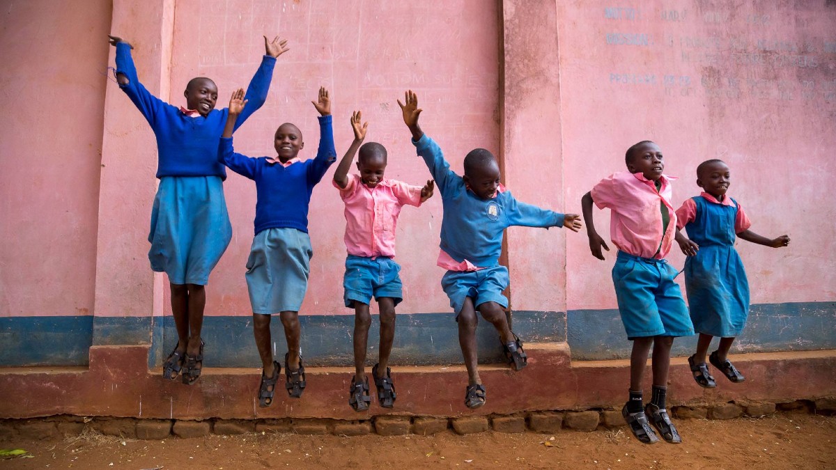 School kids jump for joy in their new shoes