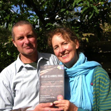 Jon James and Camilla Carr hold their book, "The Sky is Always There" that they authored together