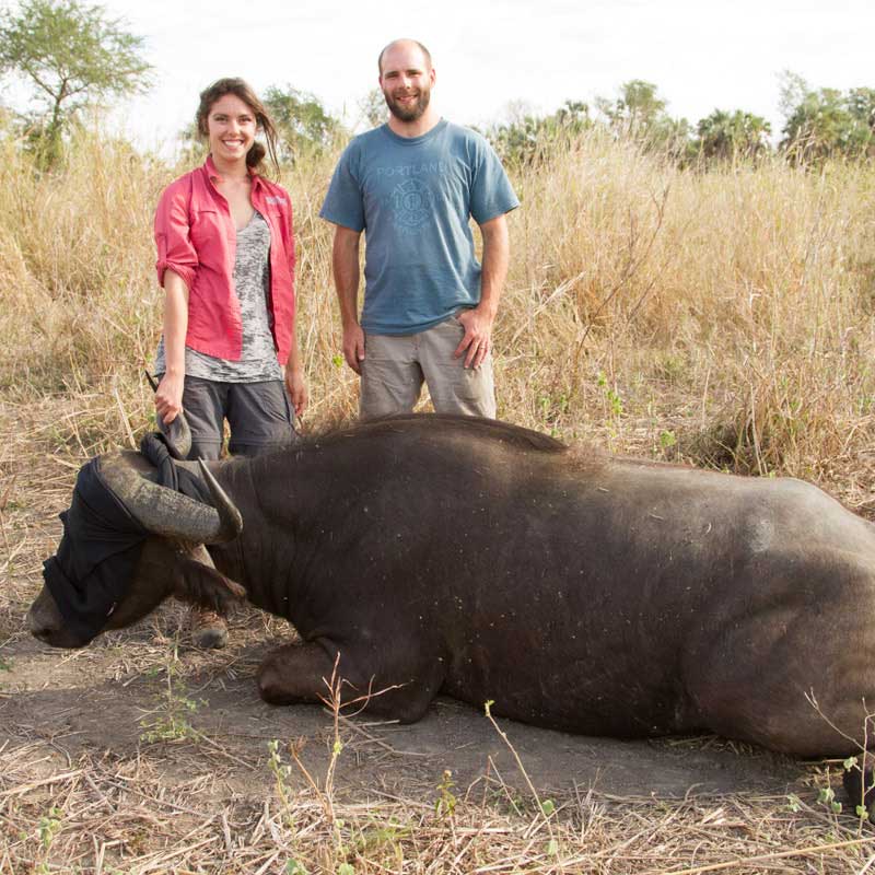 ryan long and savannah kollasch with a water buffalo