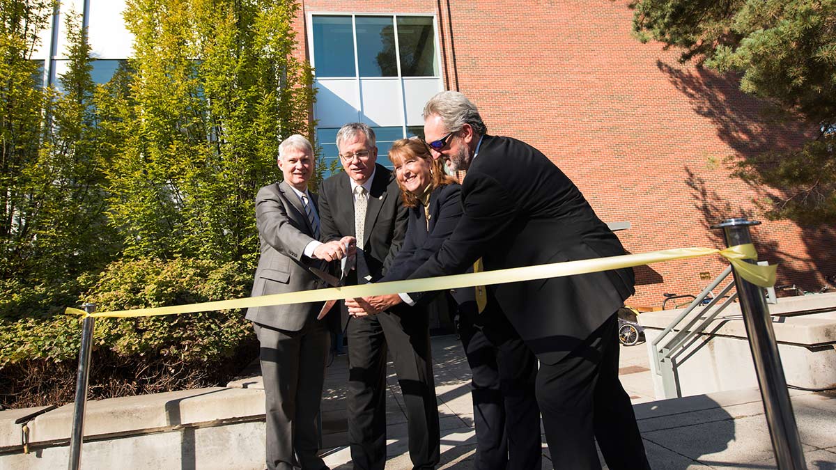 President, Provost, and Education Deans cut ribbon