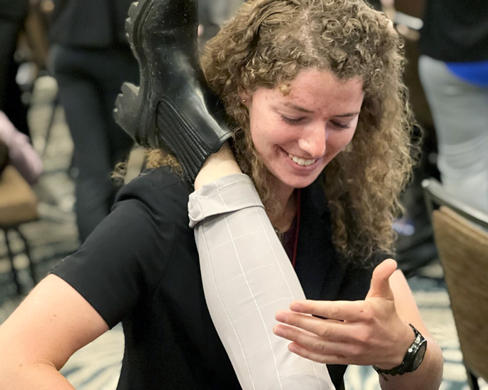 Woman performing physical therapy on patient