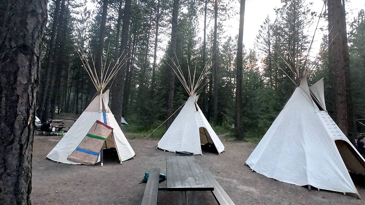 camp with three teepees