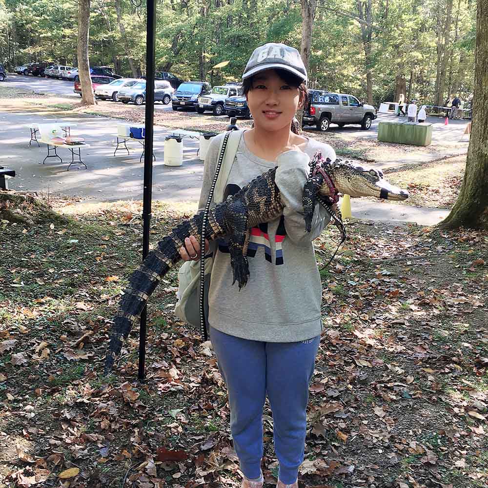 Zhe Wang with reptile
