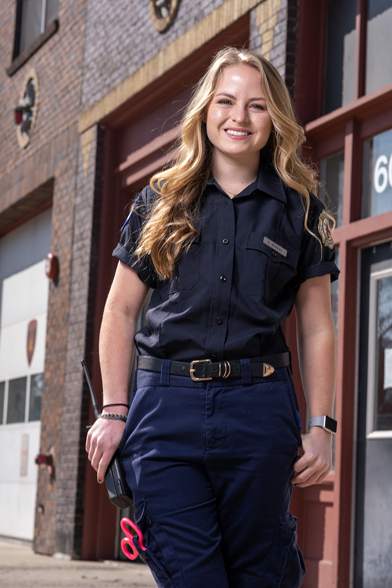 Delaney Wagers poses in her volunteer EMT uniform