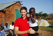 John Nuhn with little girl from his trip to east Africa.