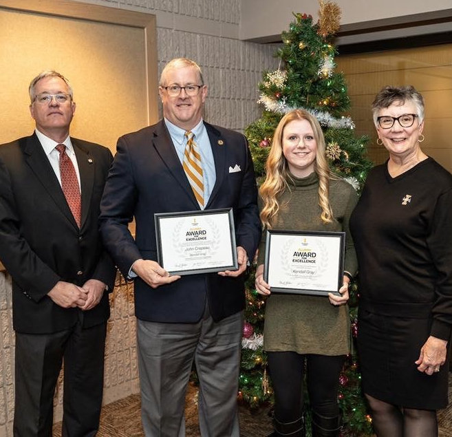 Dr. John Crepeau, Inspirational Mentor (center left) and Kendall Gray (center right), accompanied by former President Chuck Staben (far left), and Kathy Barnard (far right)