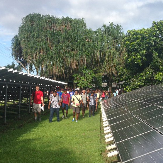Kenny Sheffler touring a solar farm in Fiji.