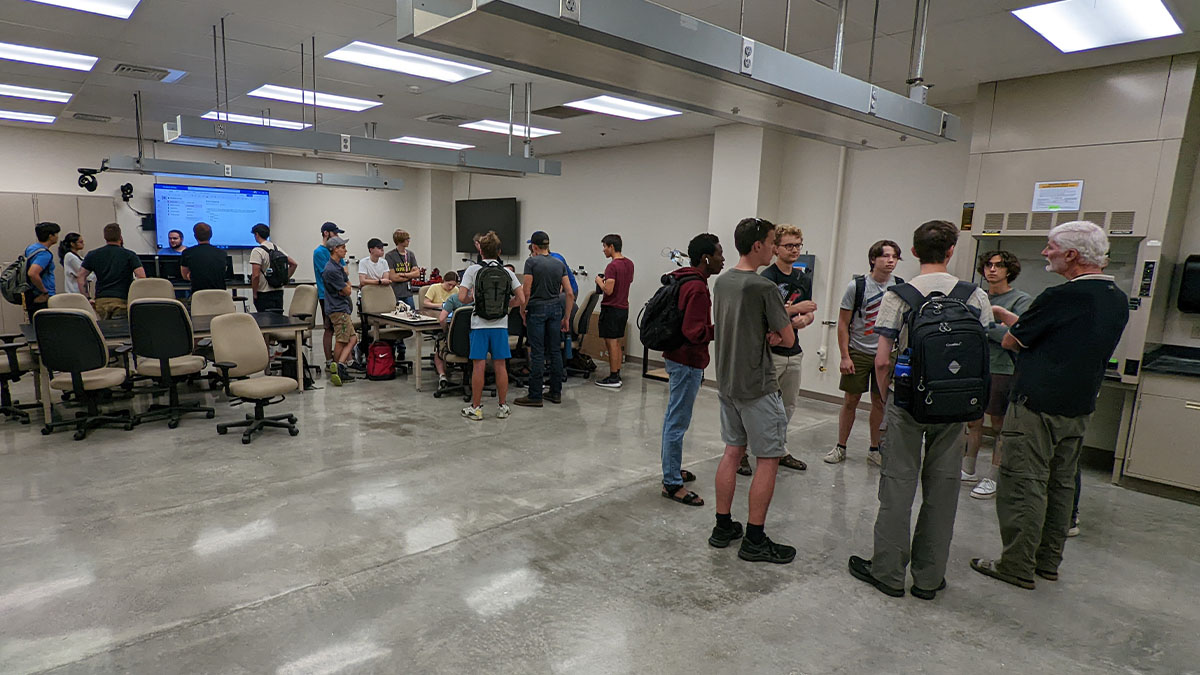 The robotics club meets in an indoor space.