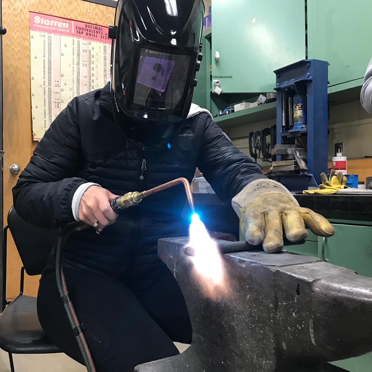 Student club member welding