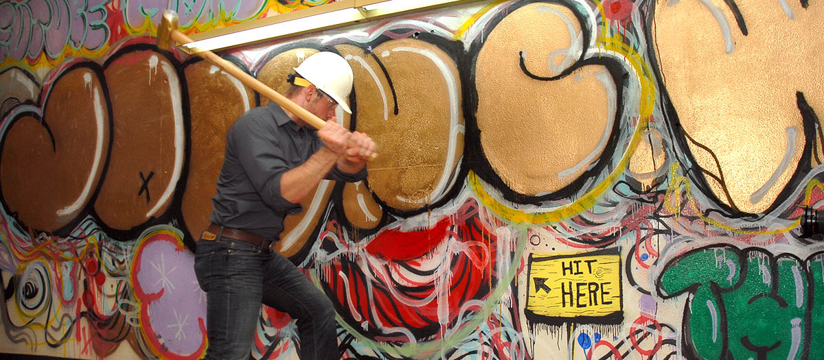 Graduating students were invited to join in demolition efforts before construction of the John C. Wahl thinkTank began.