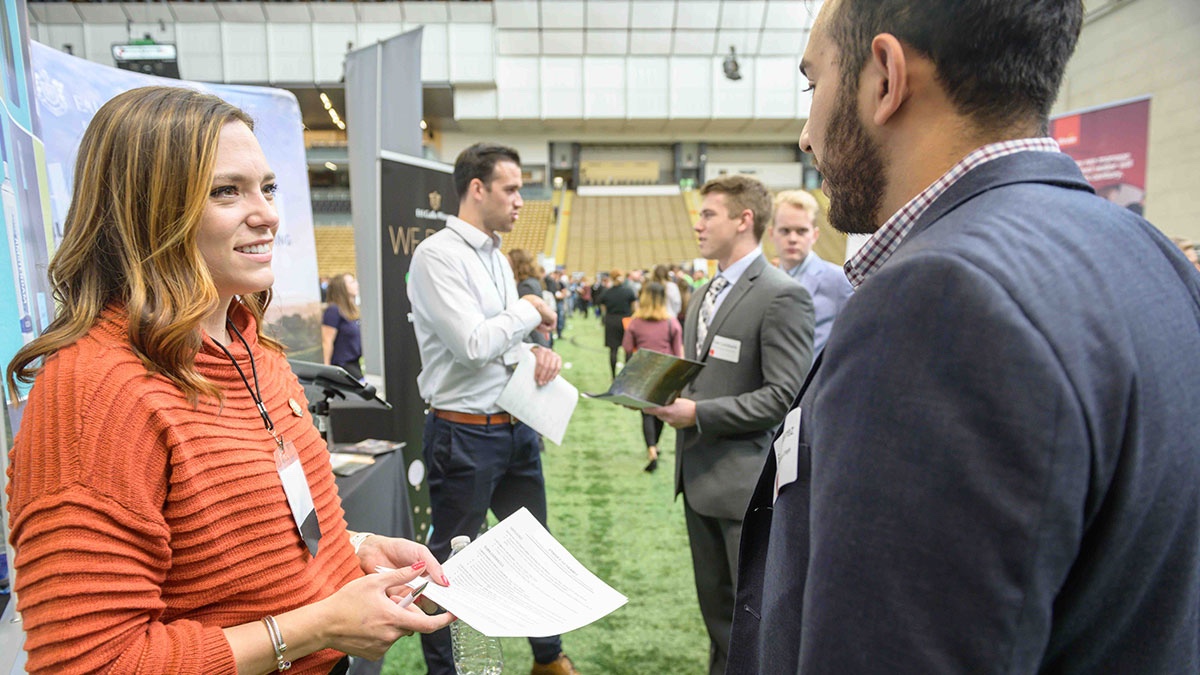 A lady talking to a recruiter.